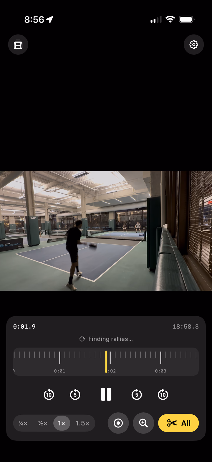 Replay Rally mid-detection, showing Finding rallies… above the jog wheel while a player swings on court.